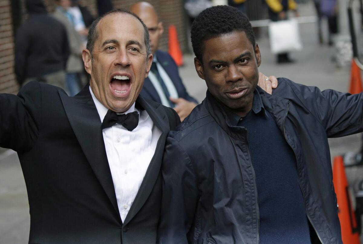 Comedians Jerry Seinfeld, left, and Chris Rock are part of Netflix's growing roster of comic talent.