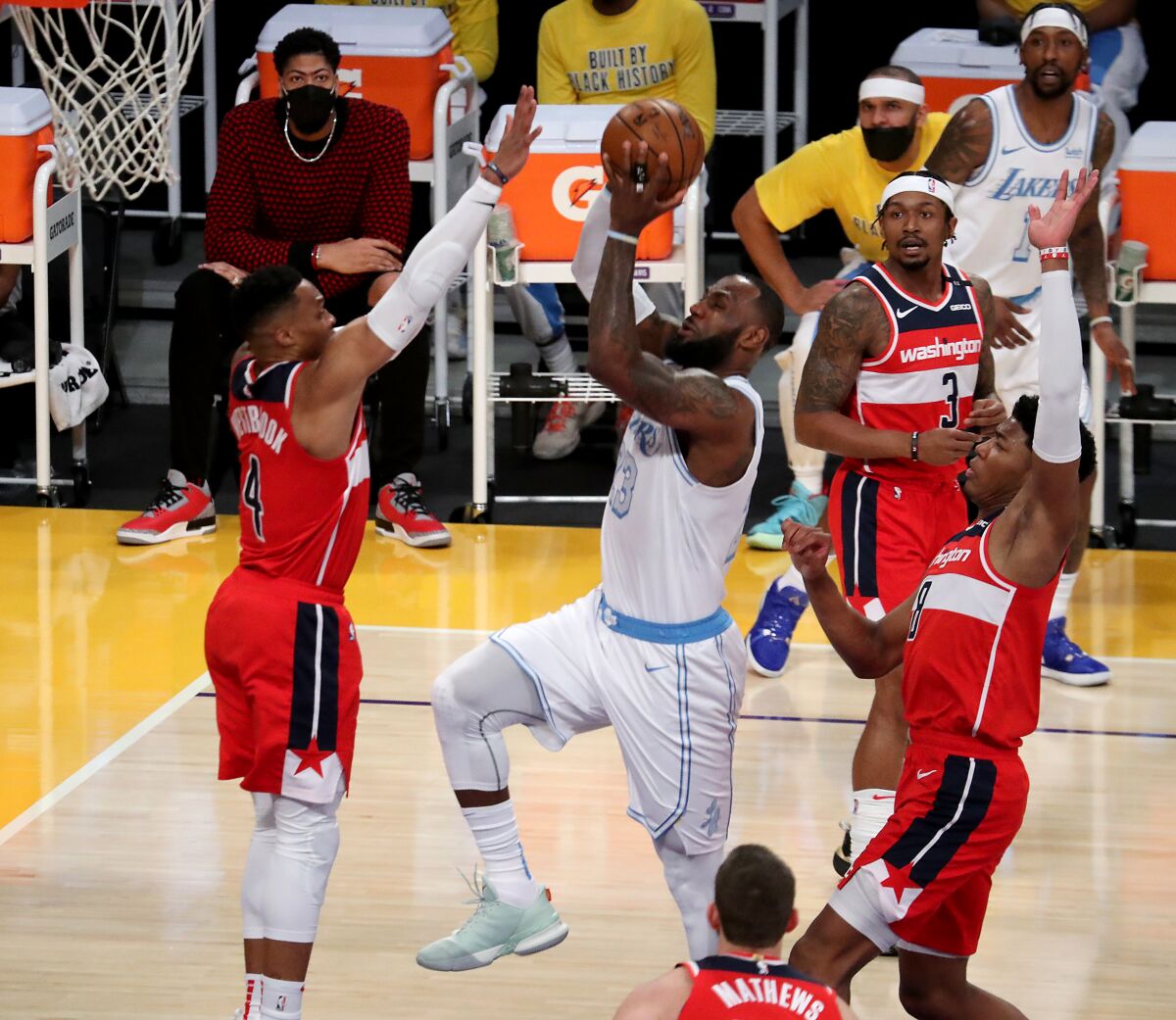 Lakers forward LeBron James slices to the basket against the Washington Wizards in the first quarter Monday.