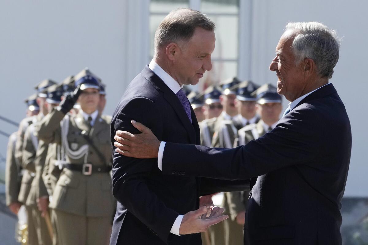 Poland's President Andrzej Duda, left, greeting Portuguese President Marcelo Rebelo de Sousa