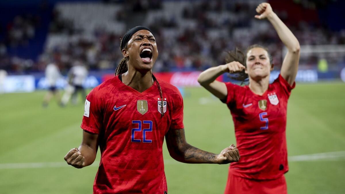 U.S. forward Jessica Mcdonald, left, and teammate Kelley O'Hara celebrate after beating England in a Women's World Cup semifinal match on Wednesday.