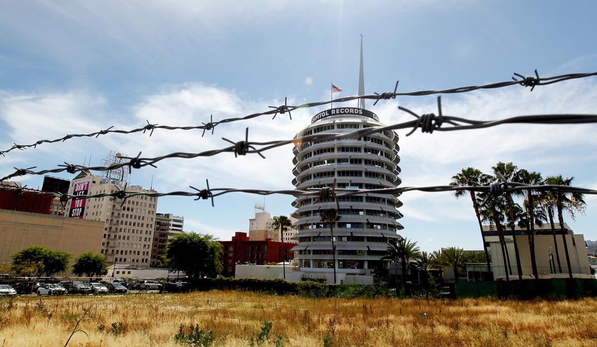 The Millennium project would put a pair of skyscrapers near the Capitol Records building in Hollywood. Some activists are seeking to put limits on projects such as these, which often require zoning variances.