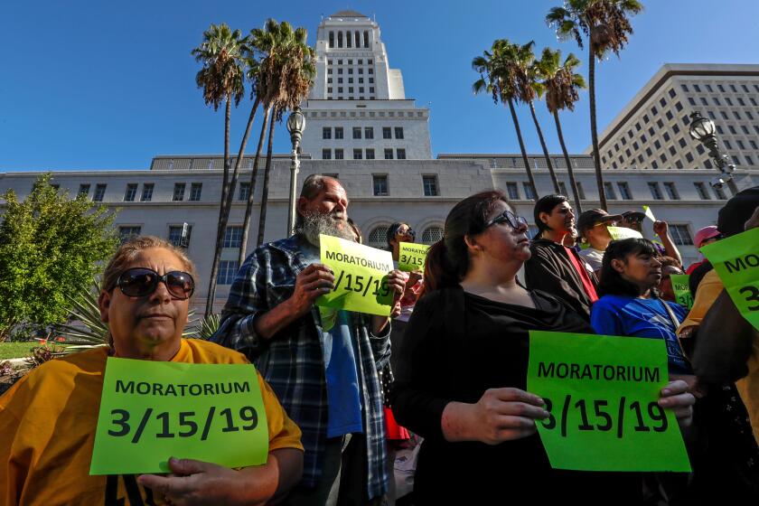 LOS ANGELES, CA - OCTOBER 22, 2019 — A coalition of tenants rally on the steps city hall on October 22, 2019, prior to the Los Angeles City Council meeting that unanimously voted to adopt an emergency ordinance to halt all ``no-fault'' evictions of tenants living in non-rent-stabilized units built before 2005 until January 1, when a state law takes effect with similar protections. (Irfan Khan/Los Angeles Times)