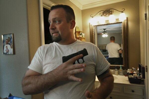 The Rev. James McAbee, pastor at Lighthouse Worship Center in Beaumont, Texas, teaches concealed handgun classes.