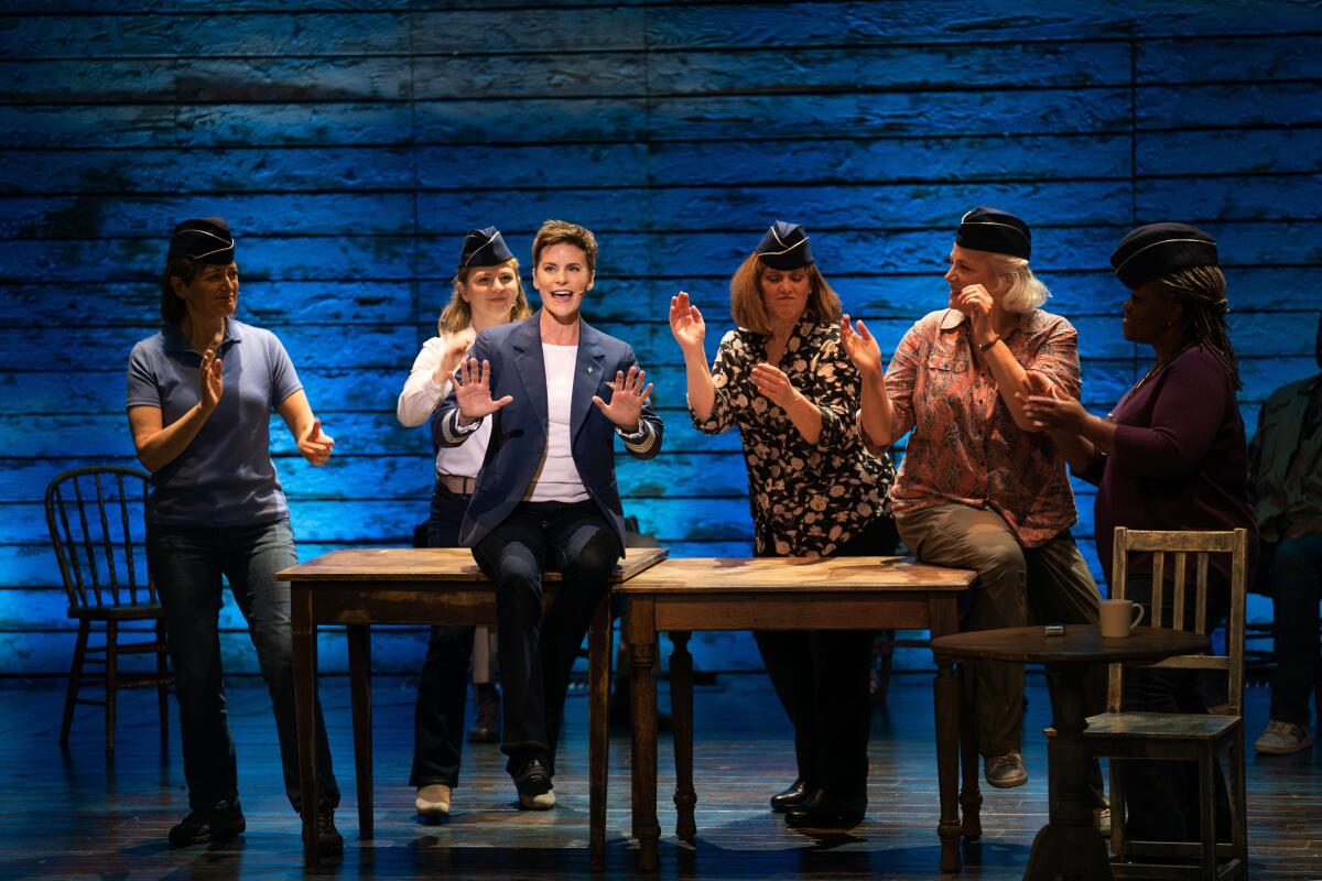 Actors playing a flight crew onstage in the musical "Come From Away."