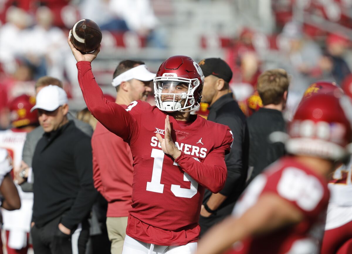 Oklahoma quarterback Caleb Williams (13) warms up before the start of an NCAA college football.