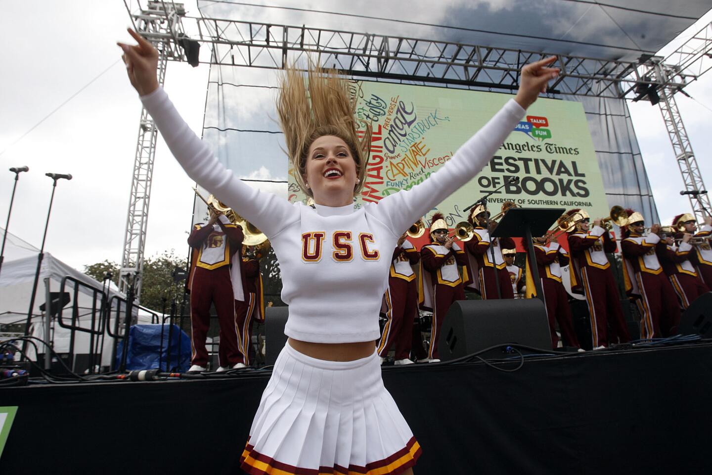 The USC marching band performs along with the USC Song Girls during the kickoff of the Los Angeles Times Festival of Books on Saturday.