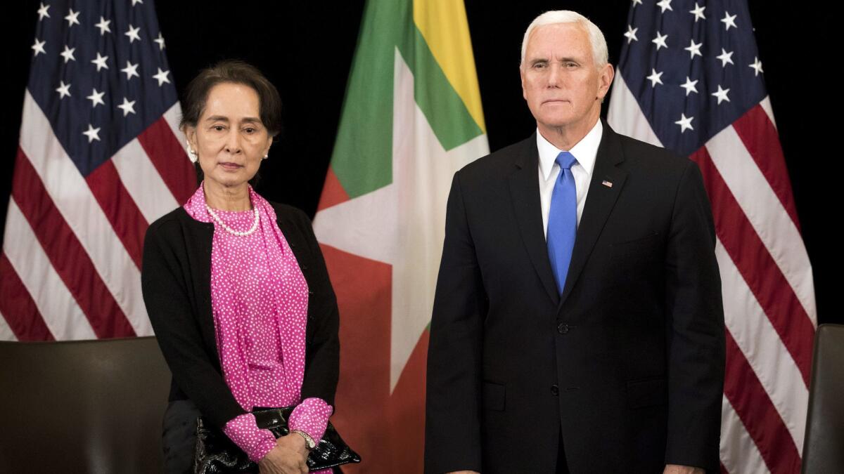 U.S. Vice President Mike Pence, right, meets Myanmar leader Aung San Suu Kyi in Singapore, on Nov. 14.