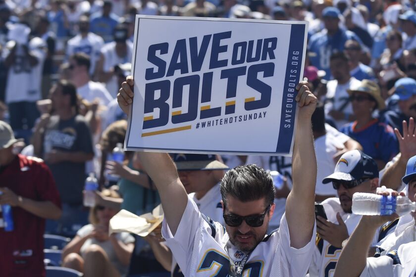A Chargers fan holds up a sign as San Diego plays the Detroit Lions during the first half of a game on Sept. 13.