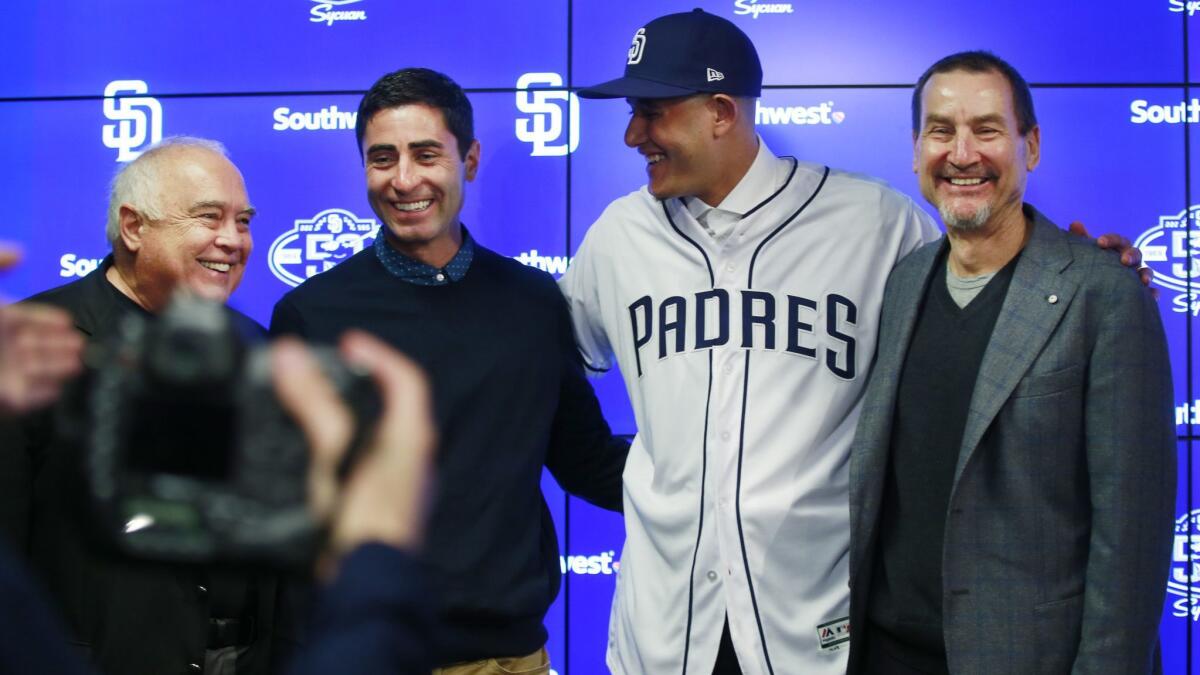 From left, Padres Executive Chairman Ron Fowler, General Manager A.J. Preller, infielder Manny Machado and General Partner Peter Seidler at a news conference in Peoria, Ariz., on Feb. 22, 2019, after Machado agreed to a 10-year, $300 million contract with the club.