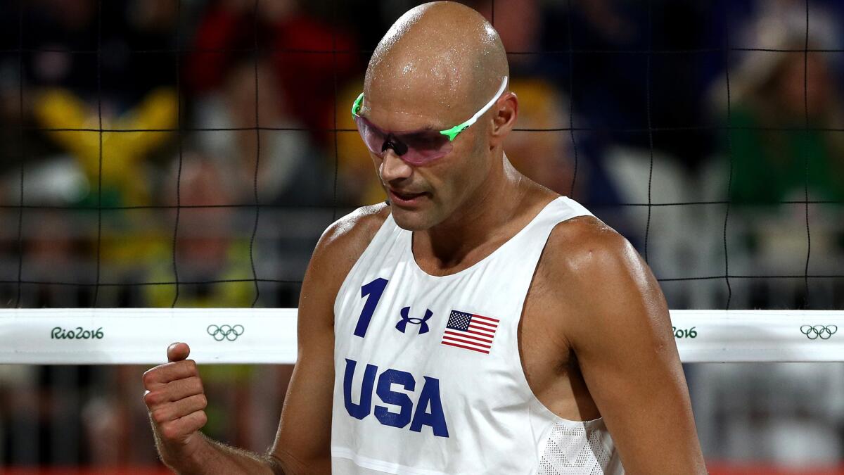 American Phil Dalhauuser and teammate Nick Lucerna (not pictured) will try to advance to the men's beach volleyball semifinals on Monday.