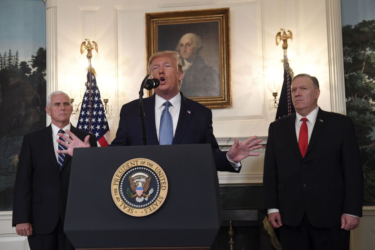 President Trump speaks about Syria next to Vice President Mike Pence and Secretary of State Mike Pompeo.
