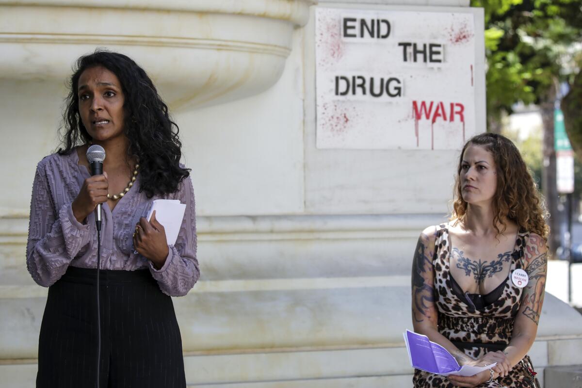 City Councilmember Nithya Raman, left, and Soma Snakeoil at a rally held to mark International Overdose Awareness Day.