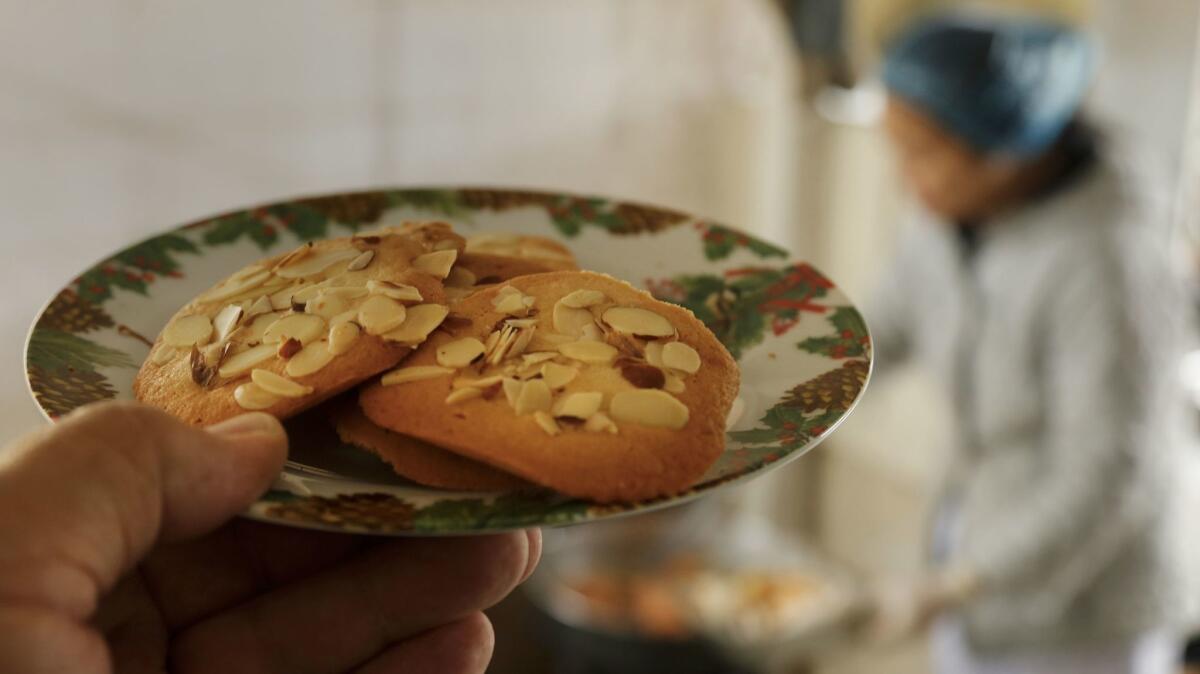 Crispy almond cookies add to Hue Phan's repertoire, baked before the meals are delivered.. (Mark Boster / Los Angeles Times)