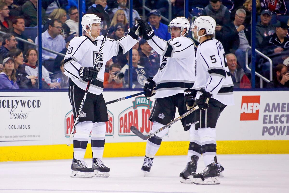 Christian Ehrhoff, left, is congratulated by Kings teammate Anze Kopitar after scoring a goal against Columbus.