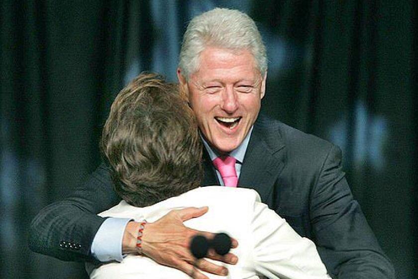 Former President Bill Clinton being greeted by Janet Murguia, NCLR Pres. & CEO during the opening of the National Conference of La Raza.