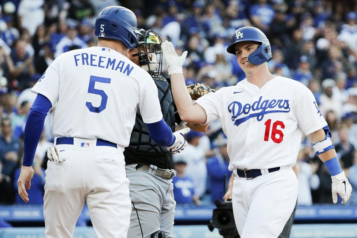 Dodgers' Will Smith, right, celebrates his home run with Freddie Freeman against the Chicago White Sox on June 13, 2023.