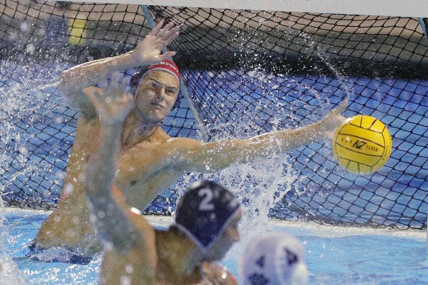 Newport Harbor's goalie Blake Jackson blocks a Loyola shot late in the second half in CIF Southern Section Division 1 semifinal water polo playoffs at the Woollett Aquatics Center in Irvine on Wednesday, November 13, 2019. Newport Harbor beat Loyola 9-5 to advance to the final.