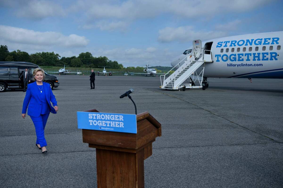 Hillary Clinton walks to speak to reporters on the tarmac at Westchester County Airport on Thursday in White Plains, N.Y.