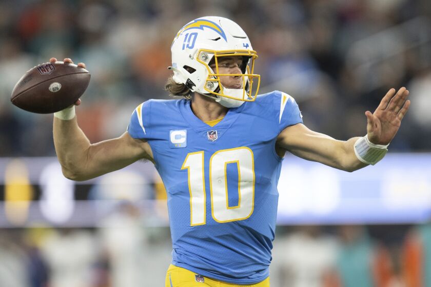 Los Angeles Chargers quarterback Justin Herbert (10) throws a pass during an NFL football game against the Miami Dolphins, Sunday, Dec. 11, 2022, in Inglewood, Calif. (AP Photo/Kyusung Gong)