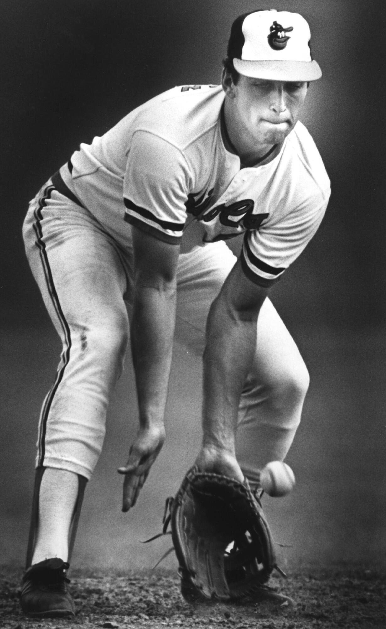 Cal Ripken Jr. scoops up a ground ball during infield practice at Miami Stadium. (February 1984)