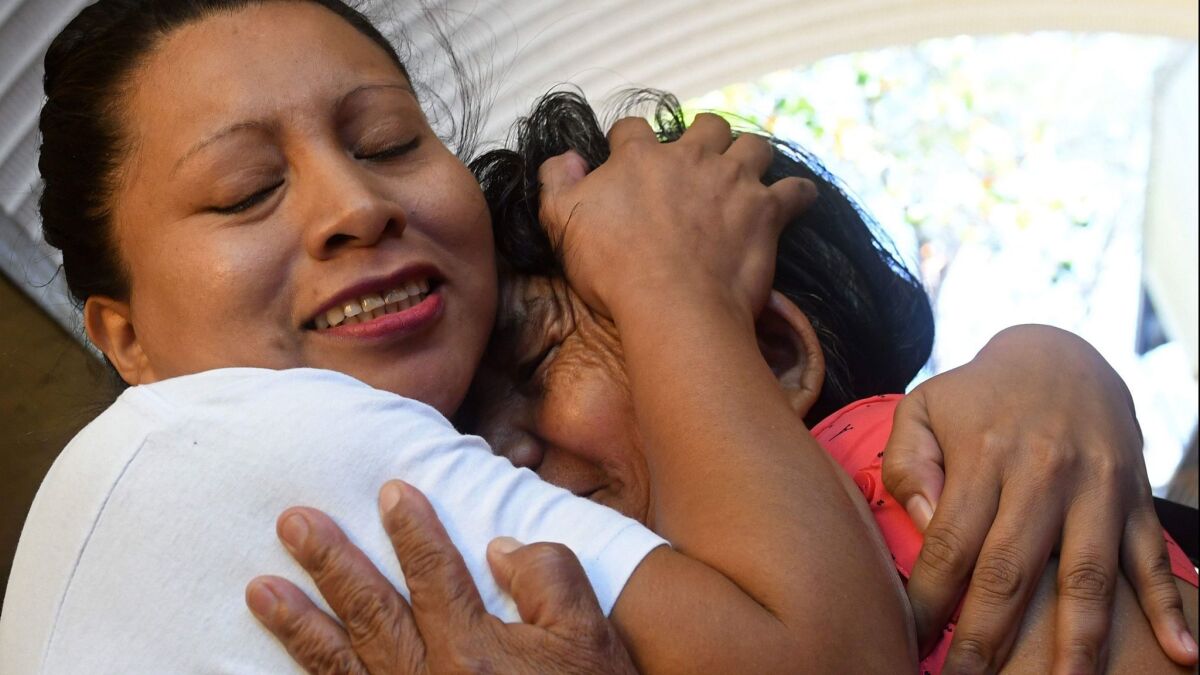 Teodora del Carmen Vasquez, left, hugs her mother shortly after being released from prison in Ilopango, El Salvador, on Thursday.