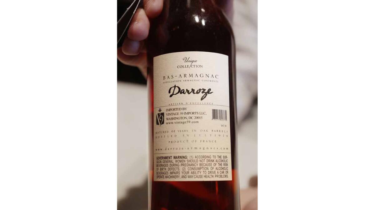The label on the back states the Unique Collection Darroze, Bas-Armagnac 1918 Domaine De Picpout has been matured for 61 years in an oak barrel.