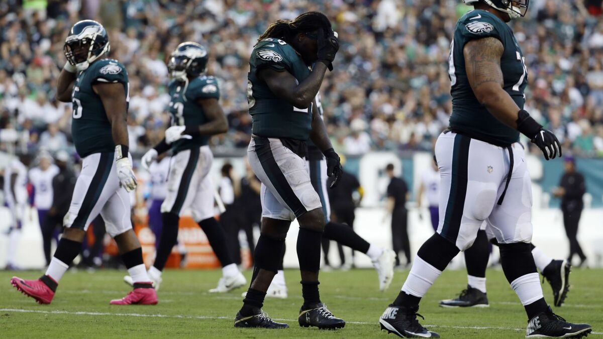 Eagles running back Jay Ajayi walks off the field after fumbling against the Vikings.