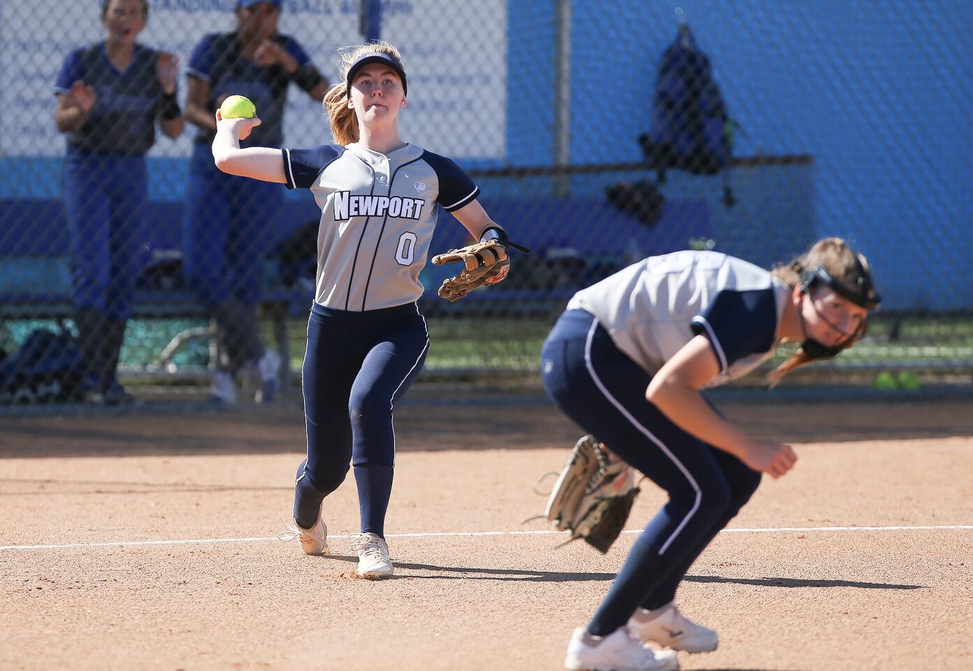 Newport Harbor third baseman Lily Larkins (0) throws to first for an out in a Wave League game at Fountain Valley on Wednesday.