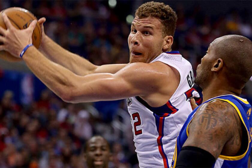 Blake Griffin drives to the basket against Golden State's Mareese Speights.