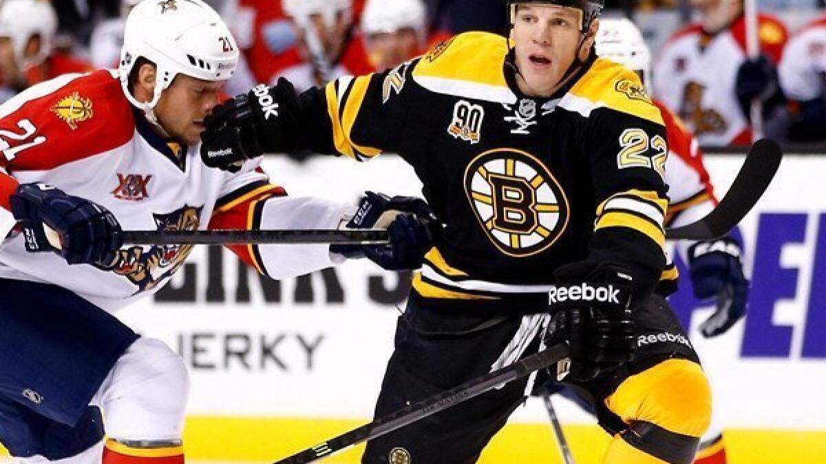 Boston Bruins player Shawn Thornton brings the Stanley Cup to