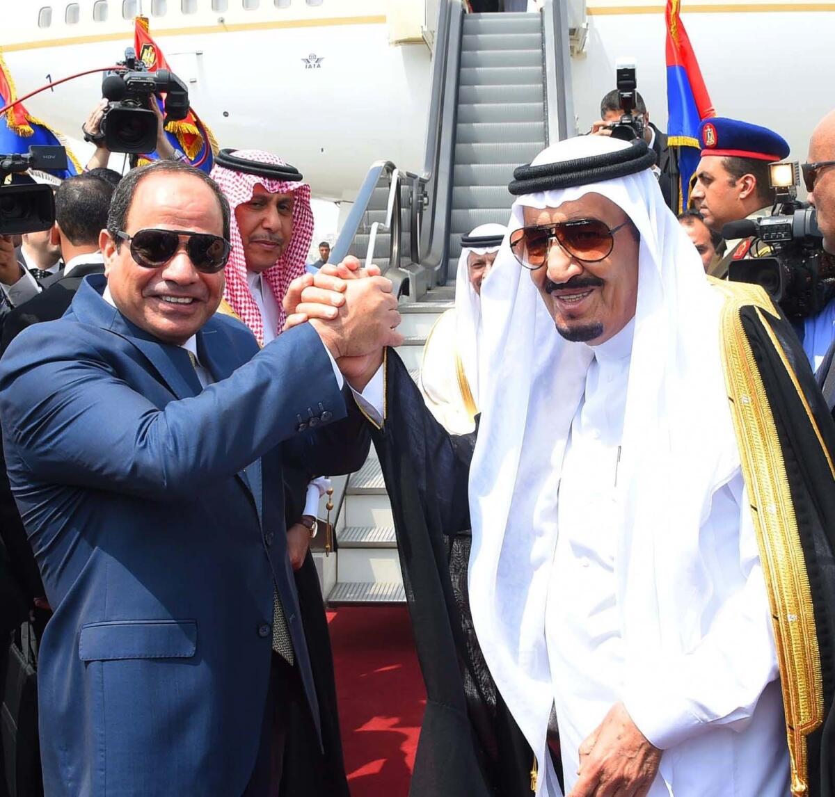 Egyptian President Abdul Fattah Sisi, left, shakes hands with Saudi Arabia's King Salman in Cairo before the monarch ended his visit to Egypt on April 11, 2016.