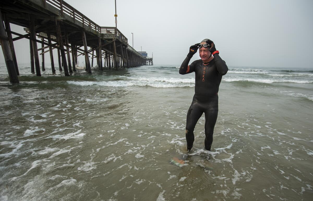 Kenneth Mullinix, who survived a stroke in 2015, prepares for a swim in the ocean.