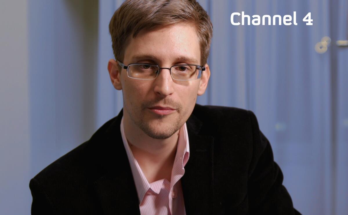 A handout picture from Britain's Channel 4 shows intelligence leaker Edward Snowden preparing to make his television Christmas message.