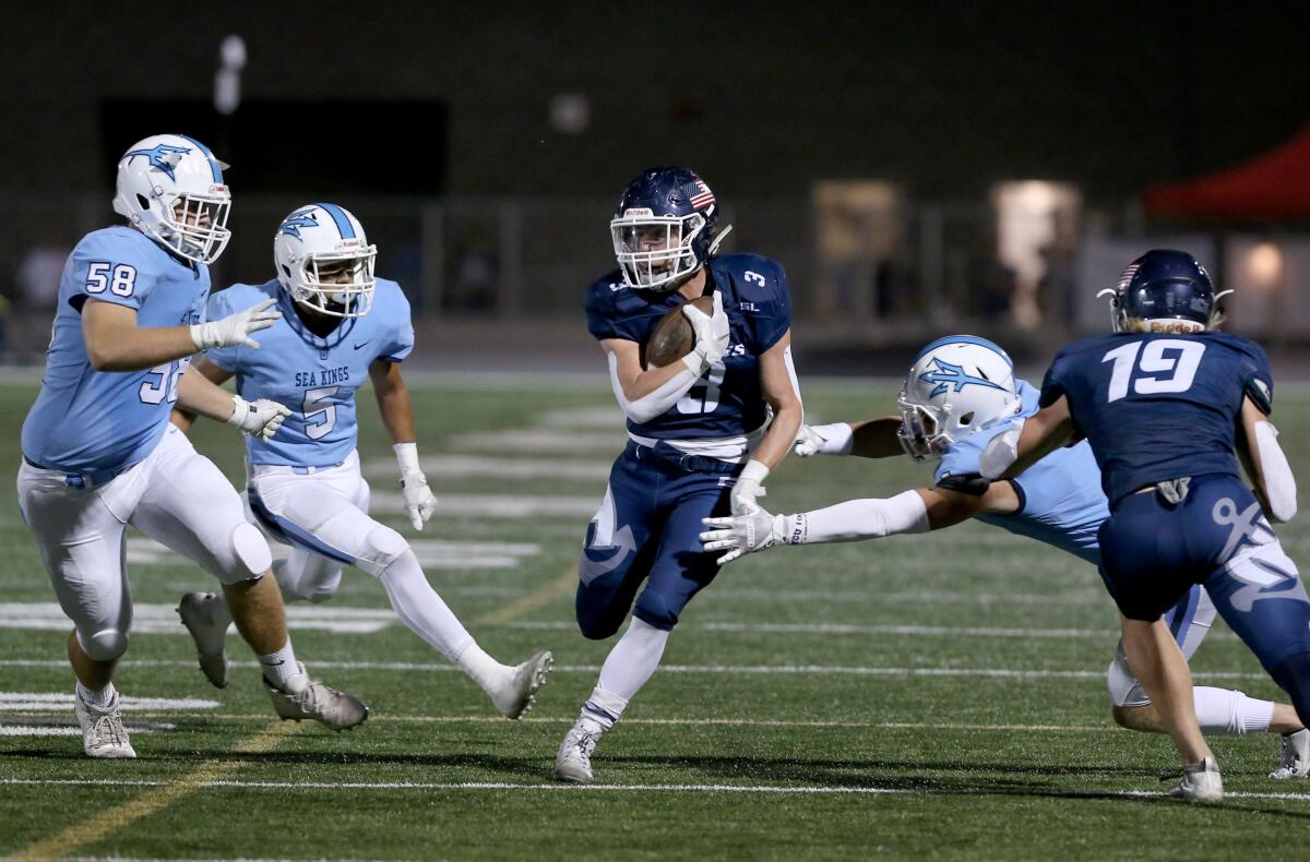 Newport Harbor's Justin McCoy finds an opening in the Battle of the Bay game against rival Corona del Mar at Davidson Field on Oct. 25.