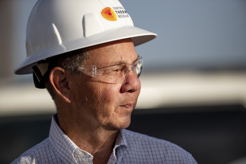 A man wears a hard hat.