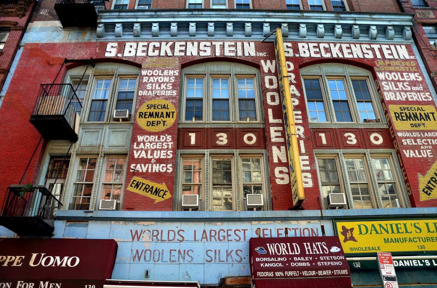 Lettering covers the front of a building on Manhattan's Lower East Side, a style of eras gone by.