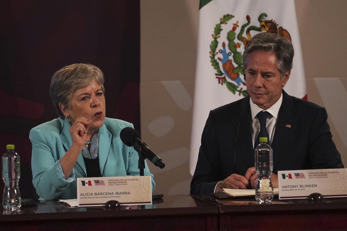 US Secretary of State Antony Blinken, right, listens as Mexican Secretary of Foreign Affairs Alicia Brcena, left, speaks during a press conference at a meeting on security, at the National Palace in Mexico City, Thursday, Oct. 5, 2023. (AP Photo/Marco Ugarte )