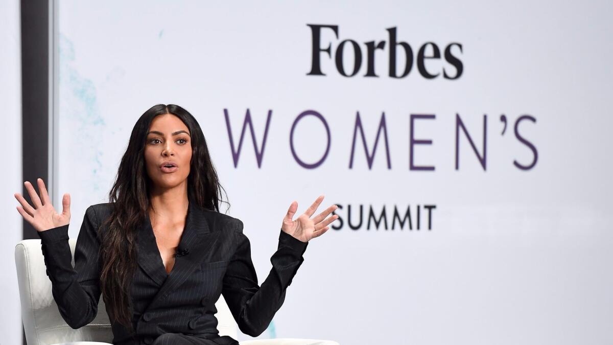 Kim Kardashian speaks on stage with Steve Forbes at the 2017 Forbes Women's Summit at Spring Studios on June 13, 2017, in New York.