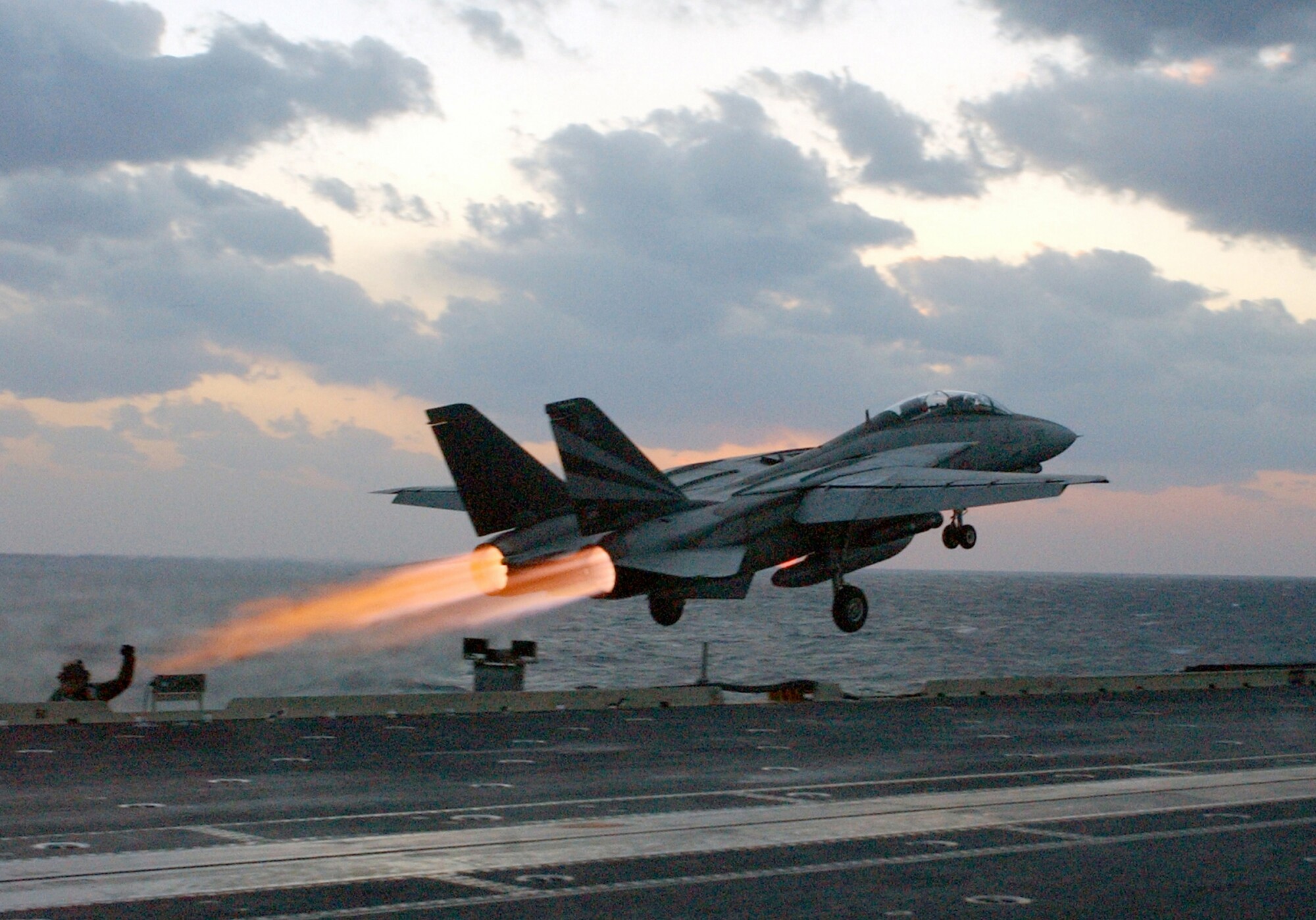 An F-14 Tomcat catapults off the bow of the Kitty Hawk