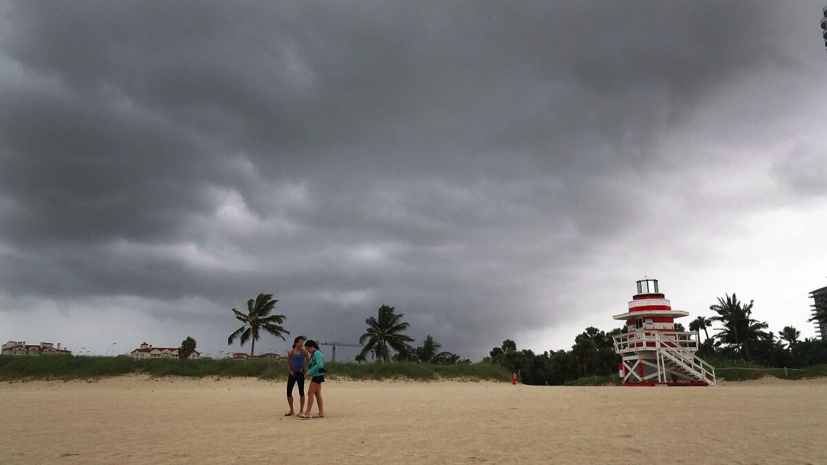 Storm clouds roll in overhead as Hurricane Irma approaches Miami Beach. Wind and rain from Irma reached South Florida on Saturday and the Florida Keys prepared for a possible direct hit.