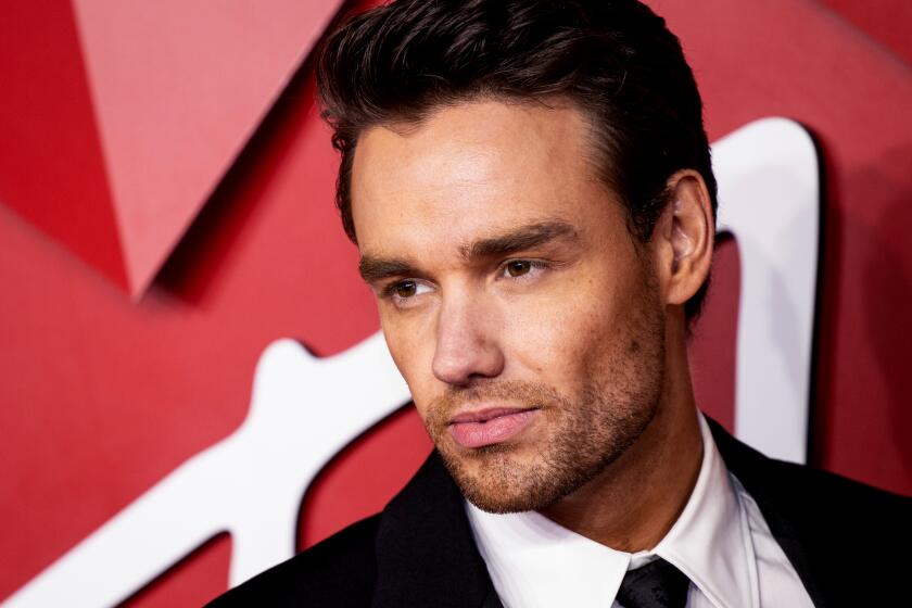 Liam Payne poses for photographers upon arrival at the British Fashion Awards in London, Monday, Dec. 5, 2022. 