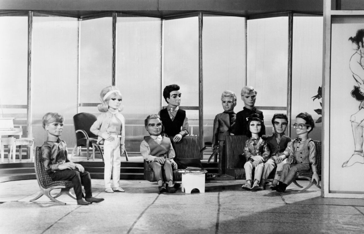 The Tracy family and allies of International Rescue, the heros of the futuristic "Supermarionation" tv show Thunderbirds. 