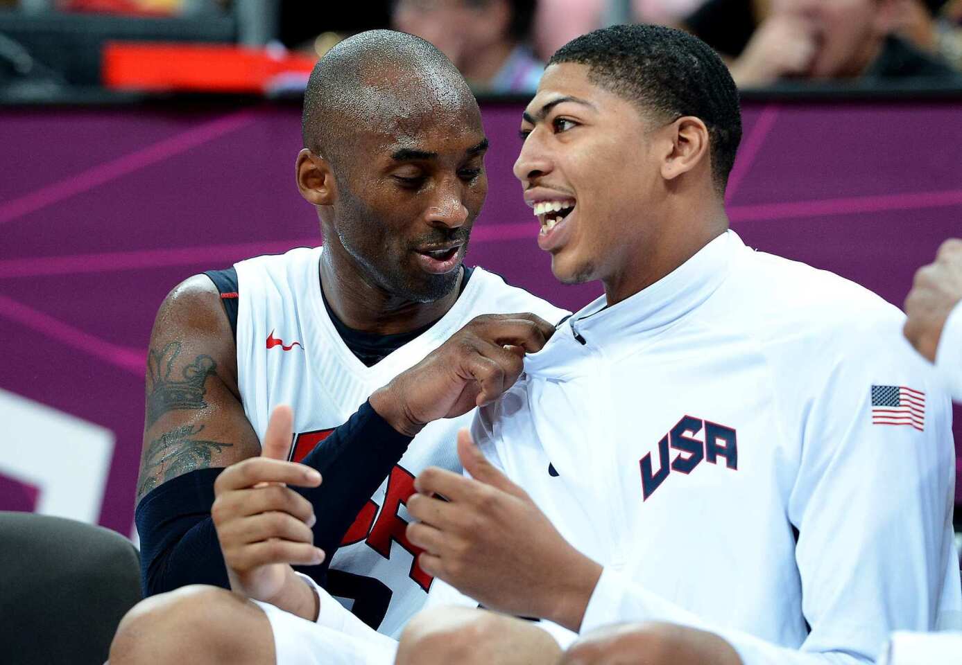 Kobe Bryant, left, and Anthony Davis chat on the bench during the U.S. basketball victory over Nigeria.