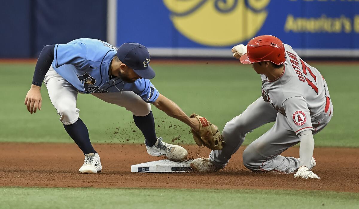 Los Angeles Angels' Shohei Ohtani (17) beats the tag from Tampa Bay Rays' Brandon Lowe.