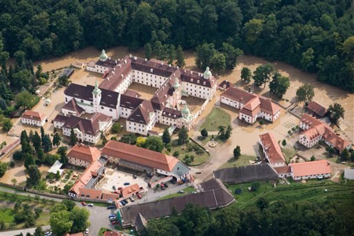 An aerial view of Neisse river near Ostritz, eastern Germany, showing the flooded Marienthal monastery on Sunday Aug. 8, 2010. The flooding in central Europe has struck an area near the borders of Poland, Germany and the Czech Republic. (AP Photo/ddp/ Jens Schlueter)