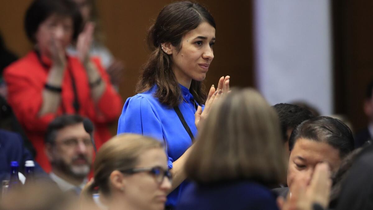 Nadia Murad is recognized by Vice President Mike Pence during his speech at the State Department in July.