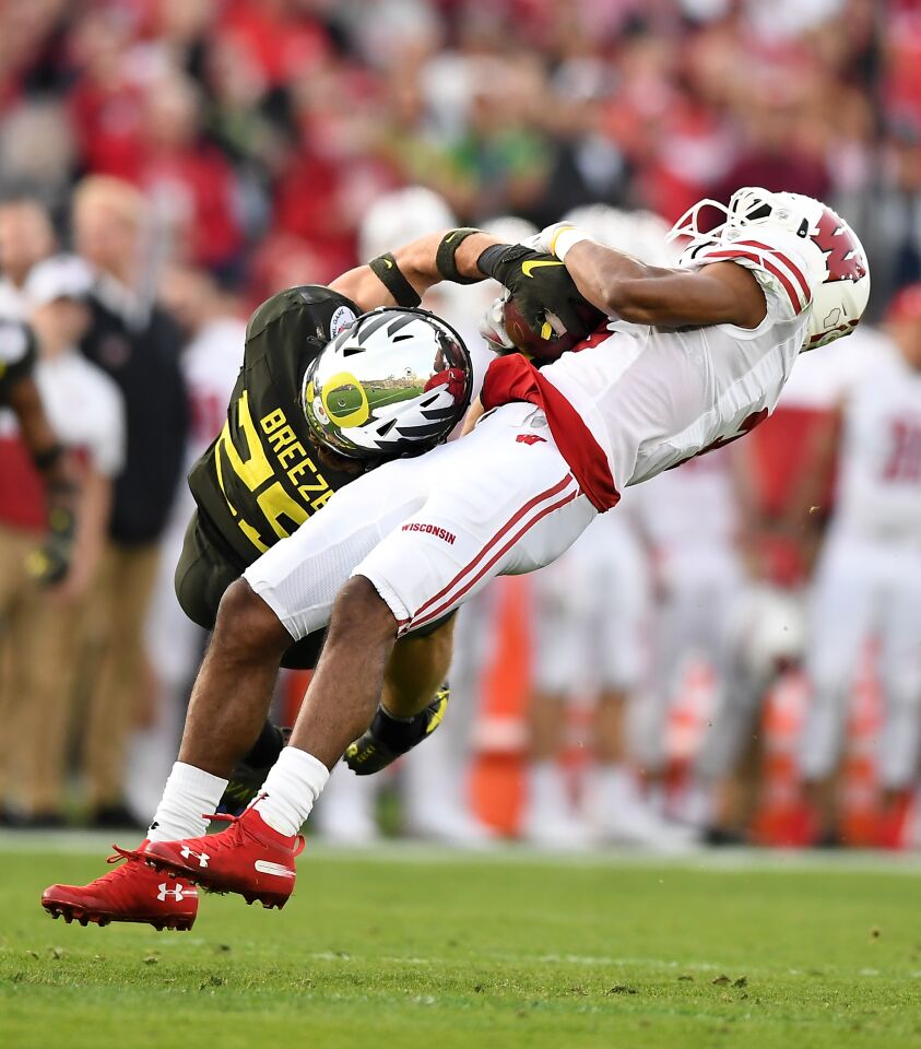 Oregon safety Brady Breeze breaks up a pass intended for Wisconsin receiver Kendric Pryor during the third quarter.