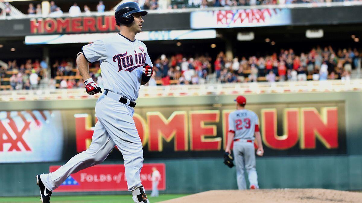 Minnesota Twins first baseman Joe Mauer circles the bases after hitting a three-run home run off Angels pitcher Alex Meyer in the second inning Monday.