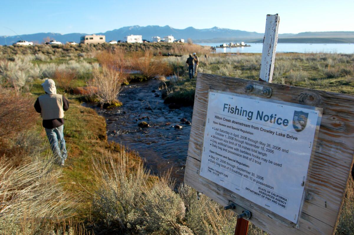 A fisherman walks toward Crowley Lake in Mammoth Lakes in this 2006 file photo.