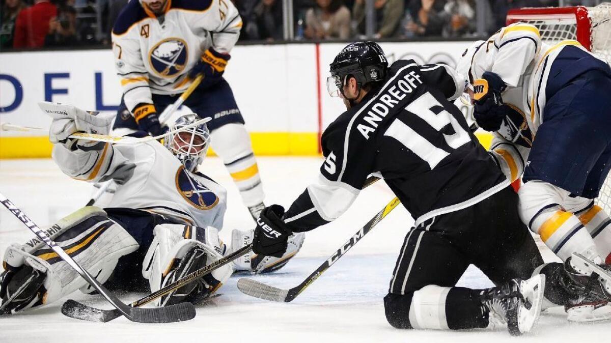 Sabres goalie Robin Lehner, left, loses his balance as he stops a shot by Kings forward Andy Andreoff during the second period on March 16.